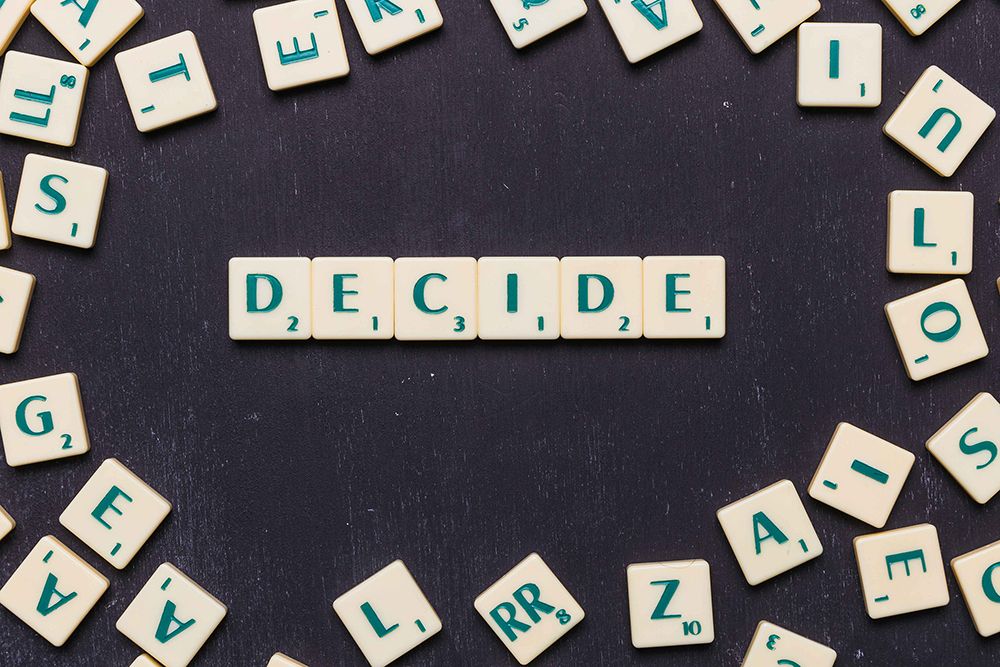 word-decide-in-scrabble-letters-over-black-backdrop-low